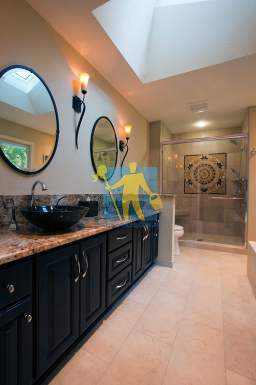 contemporary bathroom with marble tile floors and wooden cabinet and shower Kingston