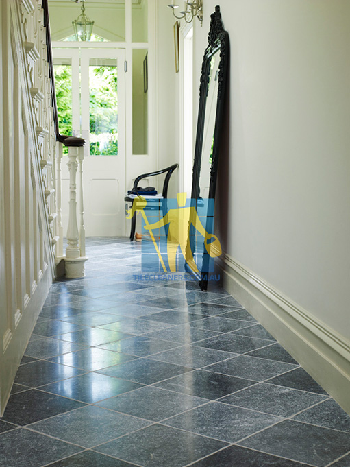 Sinnamon Park bluestone tumbled tile indoor hallway white grout