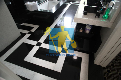 Valley View absolute black granite slab floor with white quartzite bands