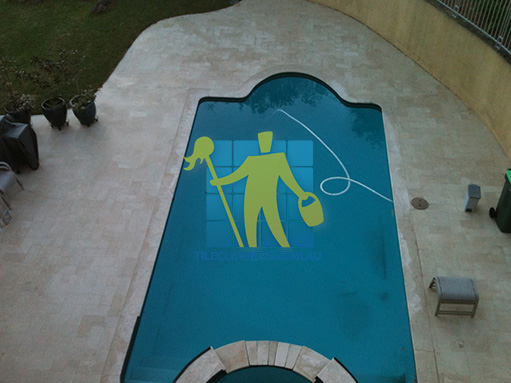 limestone outdoor tile irregular pattern around swimming pool top shot