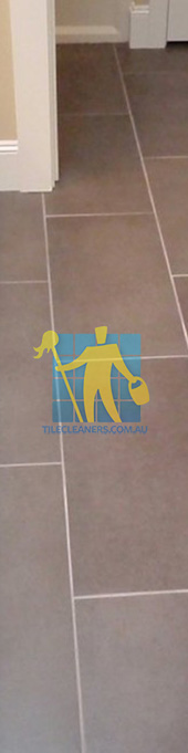 traditional bathroom with brown porcelain tiles rectangular with white grout lines Gold Coast/Currumbin