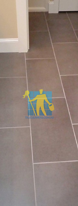traditional bathroom with brown porcelain tiles rectangular with white grout lines Canberra/Gungahlin