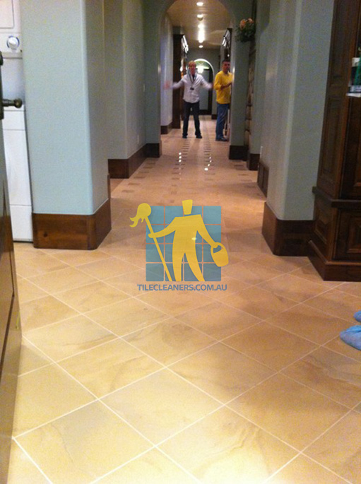 traditional entry with large porcelain tiles were laid in a basketweave pattern