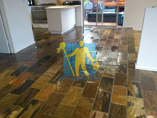 Hobart shiny floor with slate tiles after sealing still looking wet dark regular shape and size