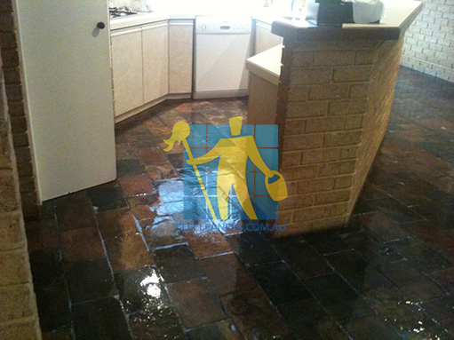 Riverview slate tiles in kitchen floor after sealing with shiny topical sealer