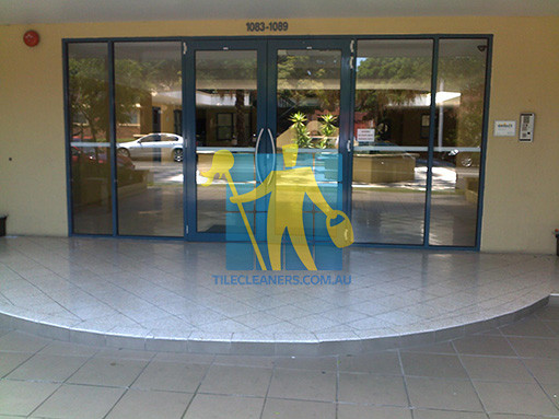 terrazzo tiles building entrance empty before cleaning angle shot reflection Hollywell