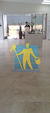 travertine tiles in large empty livingtoom large tiles after cleaning Perth