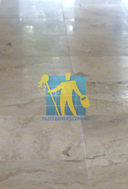 close shot of travertine tiles in large empty livingtoom large tiles after cleaning Sydney/Southern Sydney/Caringbah