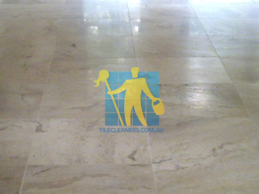 close shot of travertine tiles in large empty living room large tiles after cleaning Curramore