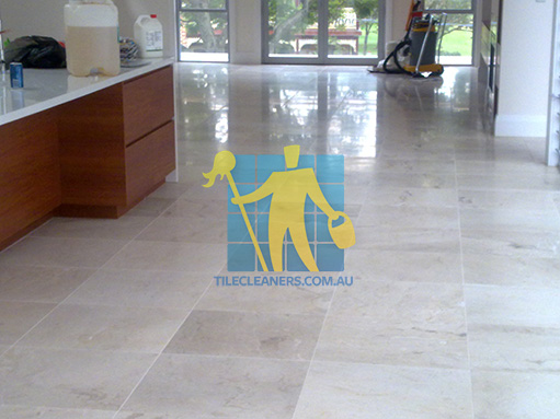 Curramore travertine tiles in large empty living room large tiles after cleaning with machines in back