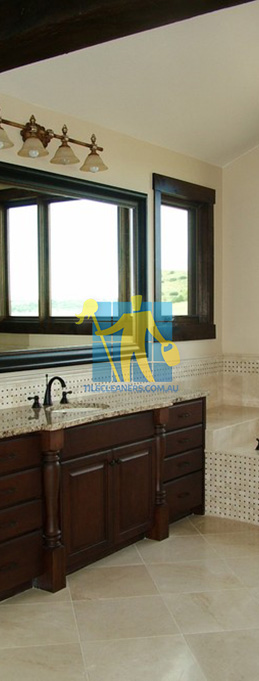 traditional bathroom with shiny stone tiles and mosaic bath tub sides wooden cabinets Canberra/Canberra Central/Hackett