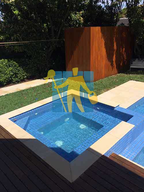Bendigo dirty lines between sandstone tiles around pool before cleaning
