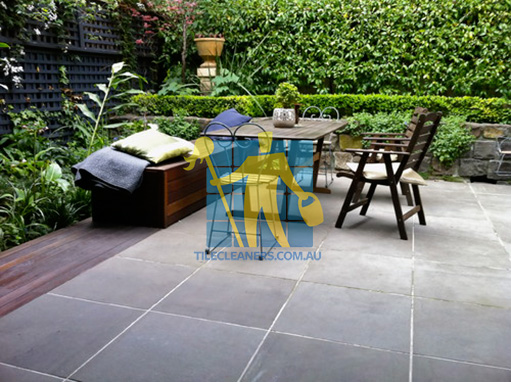 bluestone tiles white grout lines outdoor terrace dining table