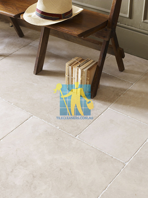 limestone tile sample storm tumbled white grout wooden chair