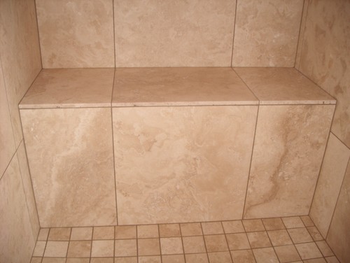 stone tile bench in traditional bathroom sealed